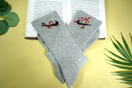 Socks embroidered with snakes and colorful flowers