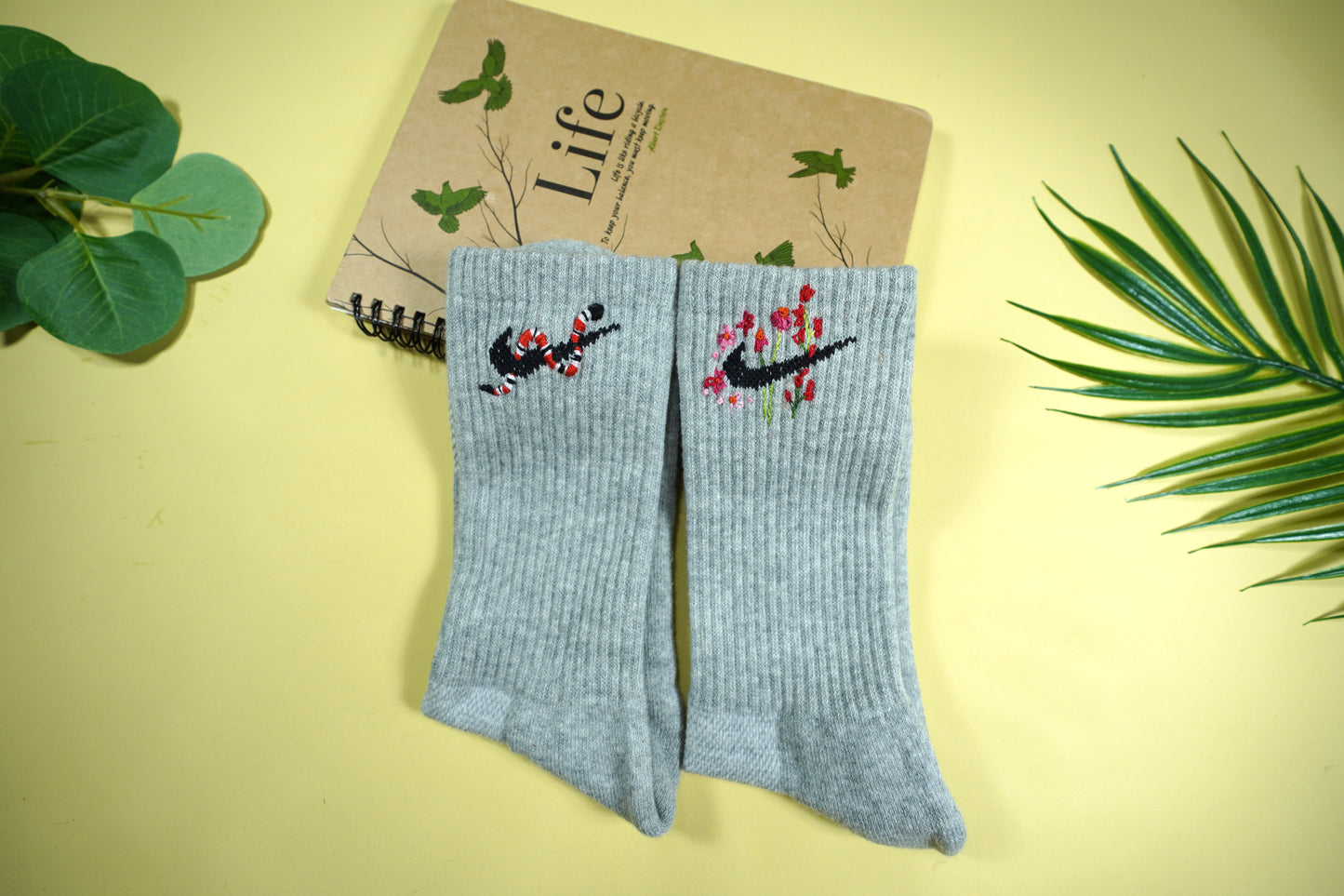 Socks embroidered with snakes and colorful flowers