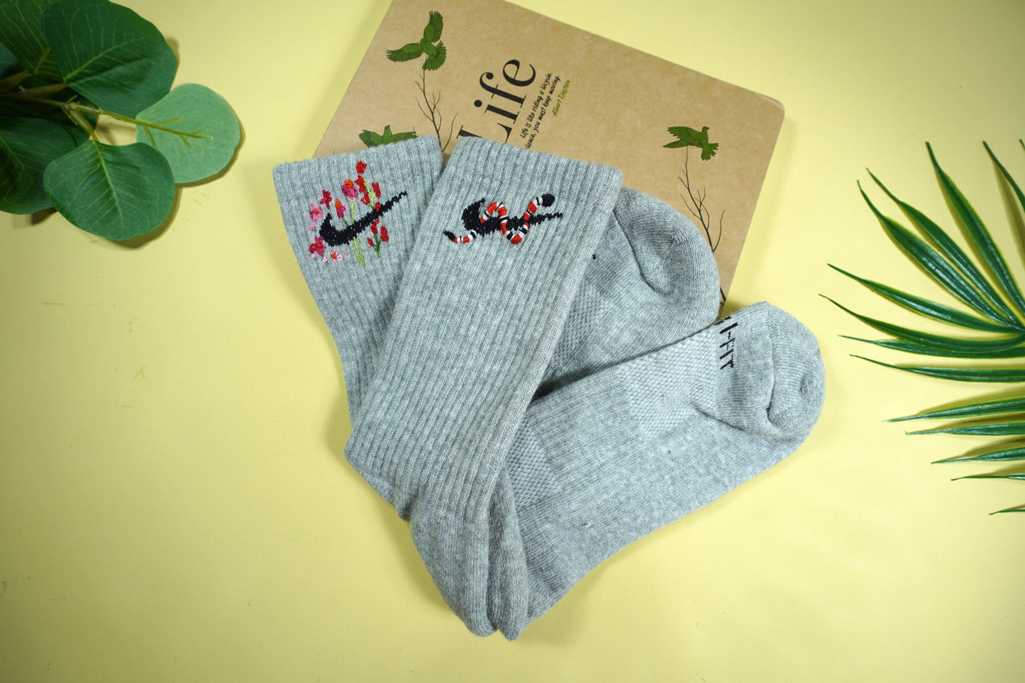 Socks embroidered with snakes and colorful flowers