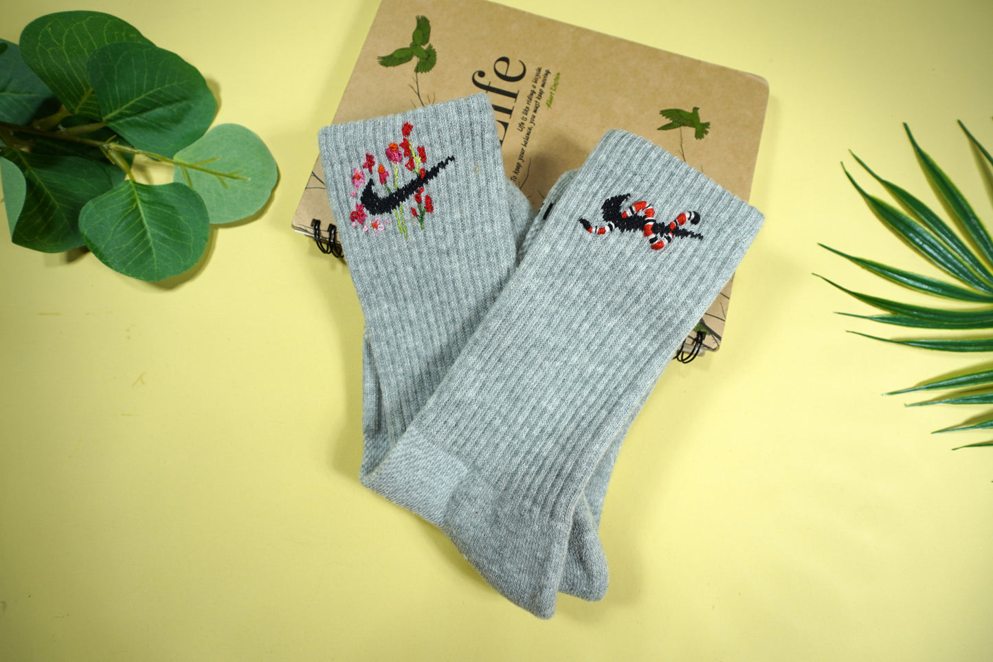 Socks embroidered with snakes and colorful flowers