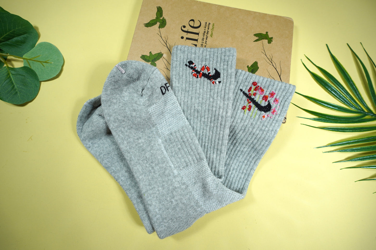 Socks embroidered with snakes and colorful flowers