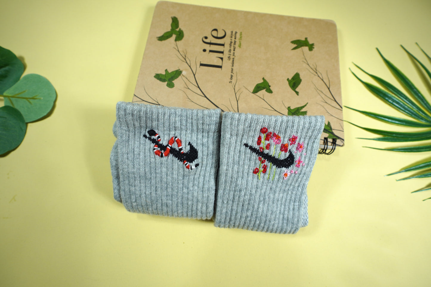 Socks embroidered with snakes and colorful flowers