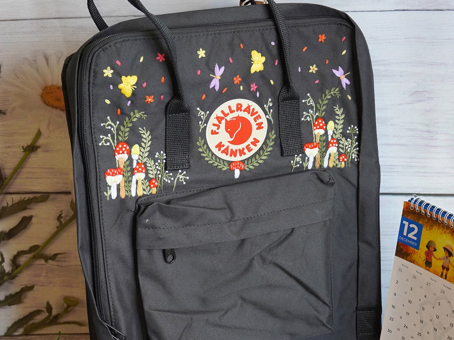 Fjallraven kanken backpack embroidered with mushrooms and butterflies