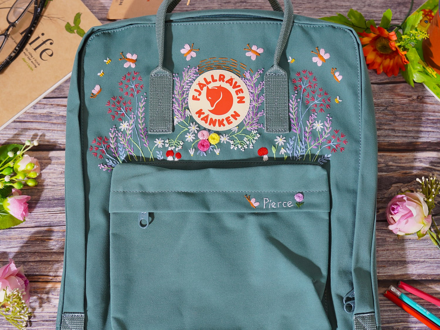 Fjallraven kanken bag with lavender and butterfly embroidery/Lavender and butterfly embroidery design on fjallraven kanken backpack