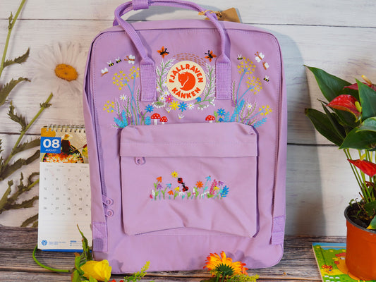 Floral and butterfly embroidery design on fjallraven kanken backpack