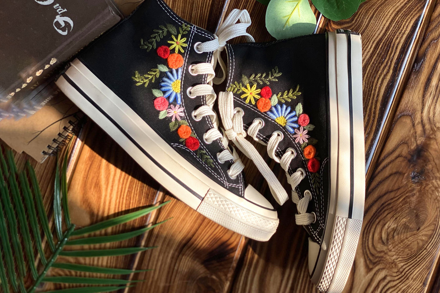 Converse High Tops shoes are embroidered with colorful flowers