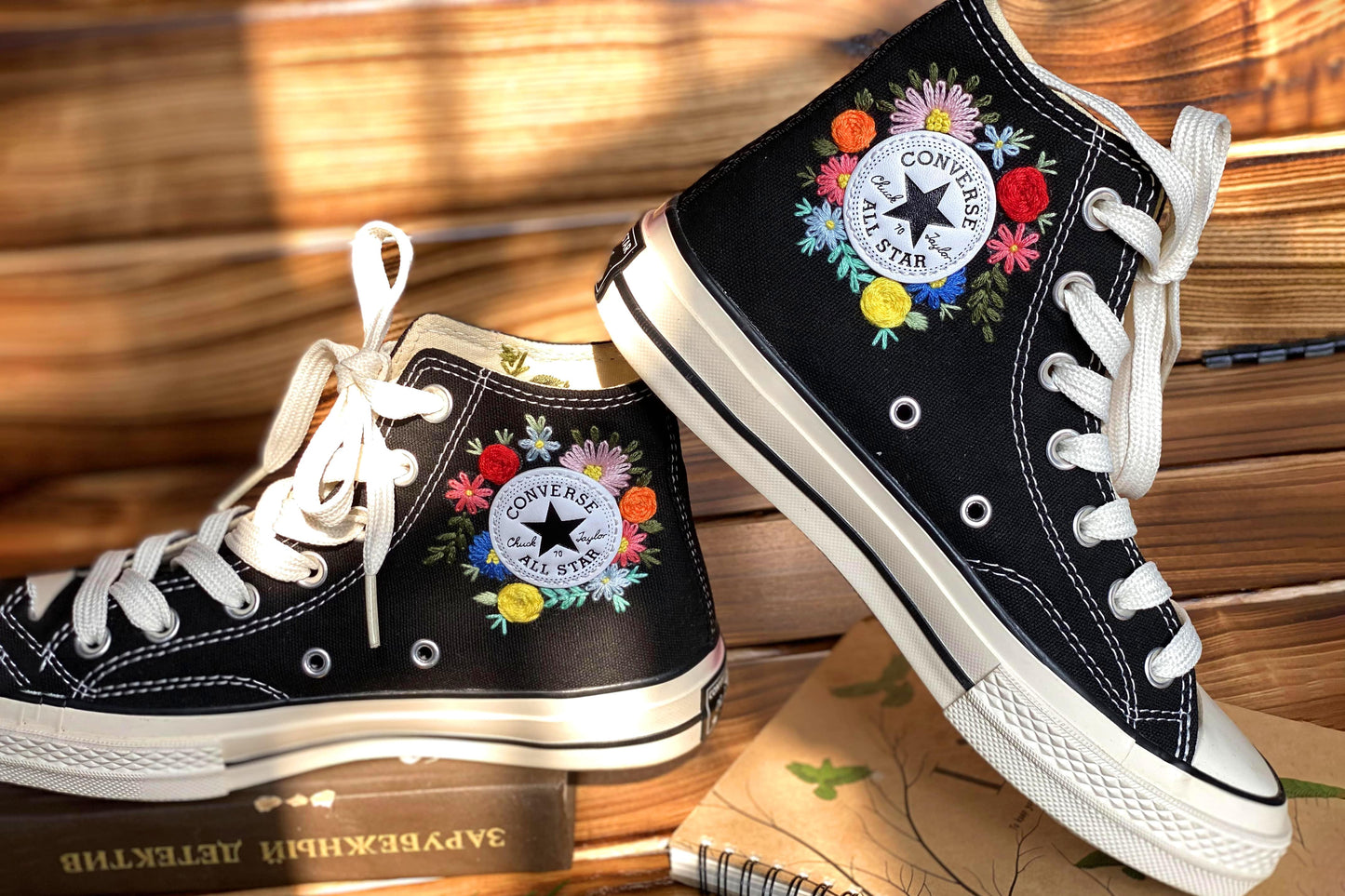 Converse High Tops shoes are embroidered with colorful flowers