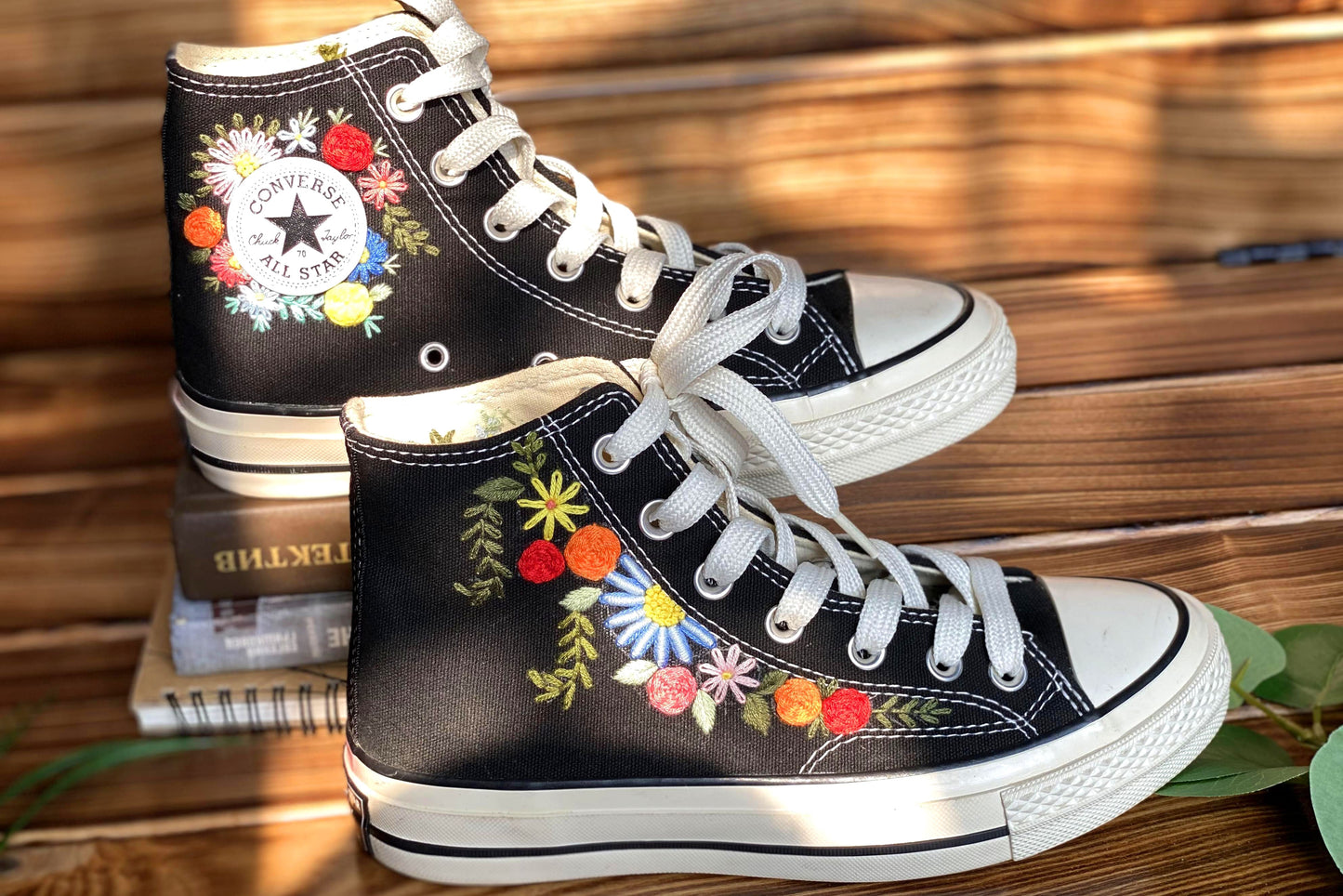 Converse High Tops shoes are embroidered with colorful flowers