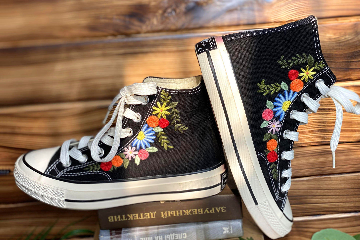 Converse High Tops shoes are embroidered with colorful flowers