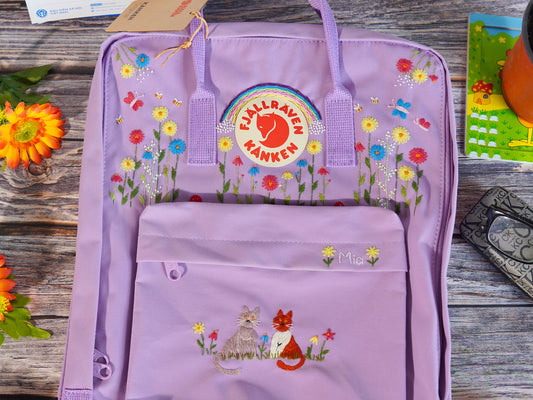 Hand embroidered fjallraven kanken backpack with rainbow flower and cat design